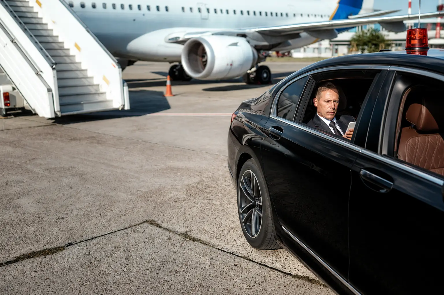 Chauffeur waiting at an airport terminal