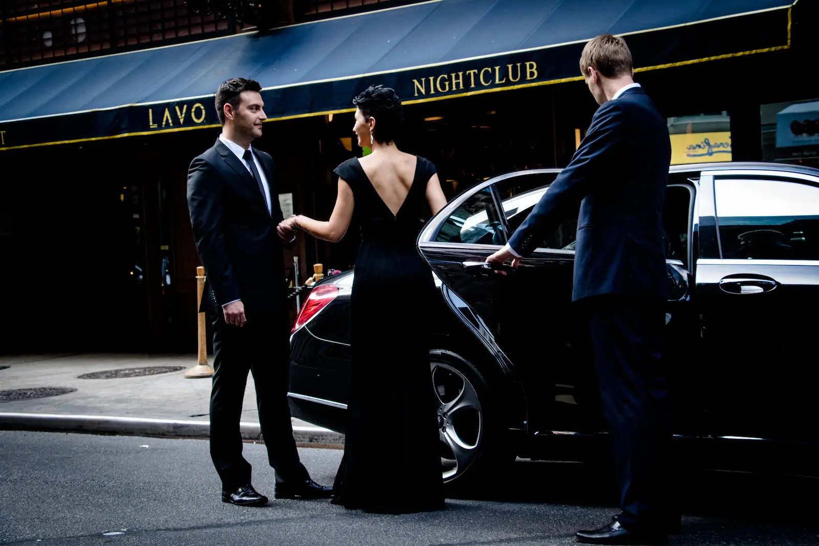 Luxury car at a formal event entrance